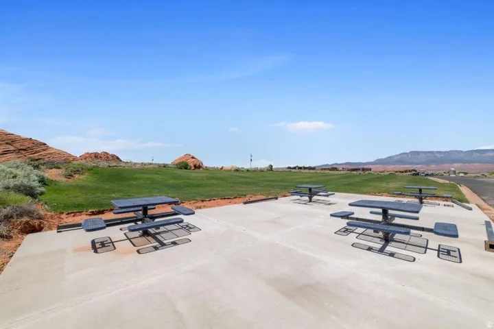 View of community with a mountain view and a patio