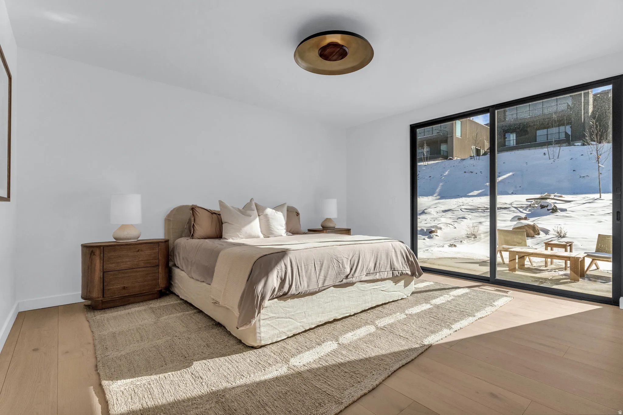 Bedroom featuring access to exterior and light wood-style floors