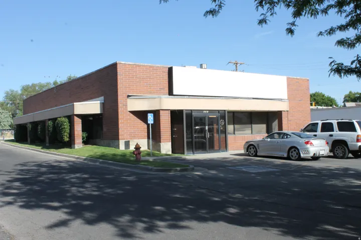 View of property with uncovered parking