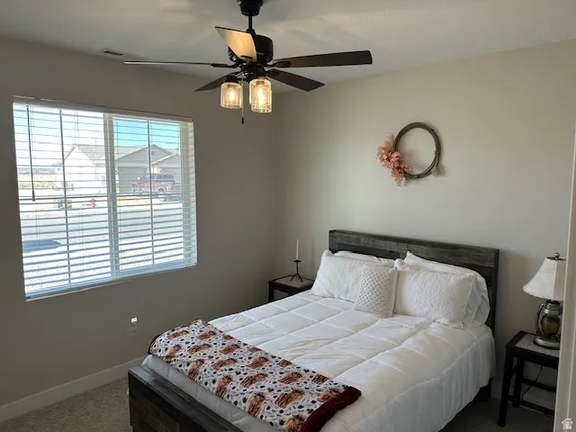 Bedroom featuring carpet and a ceiling fan