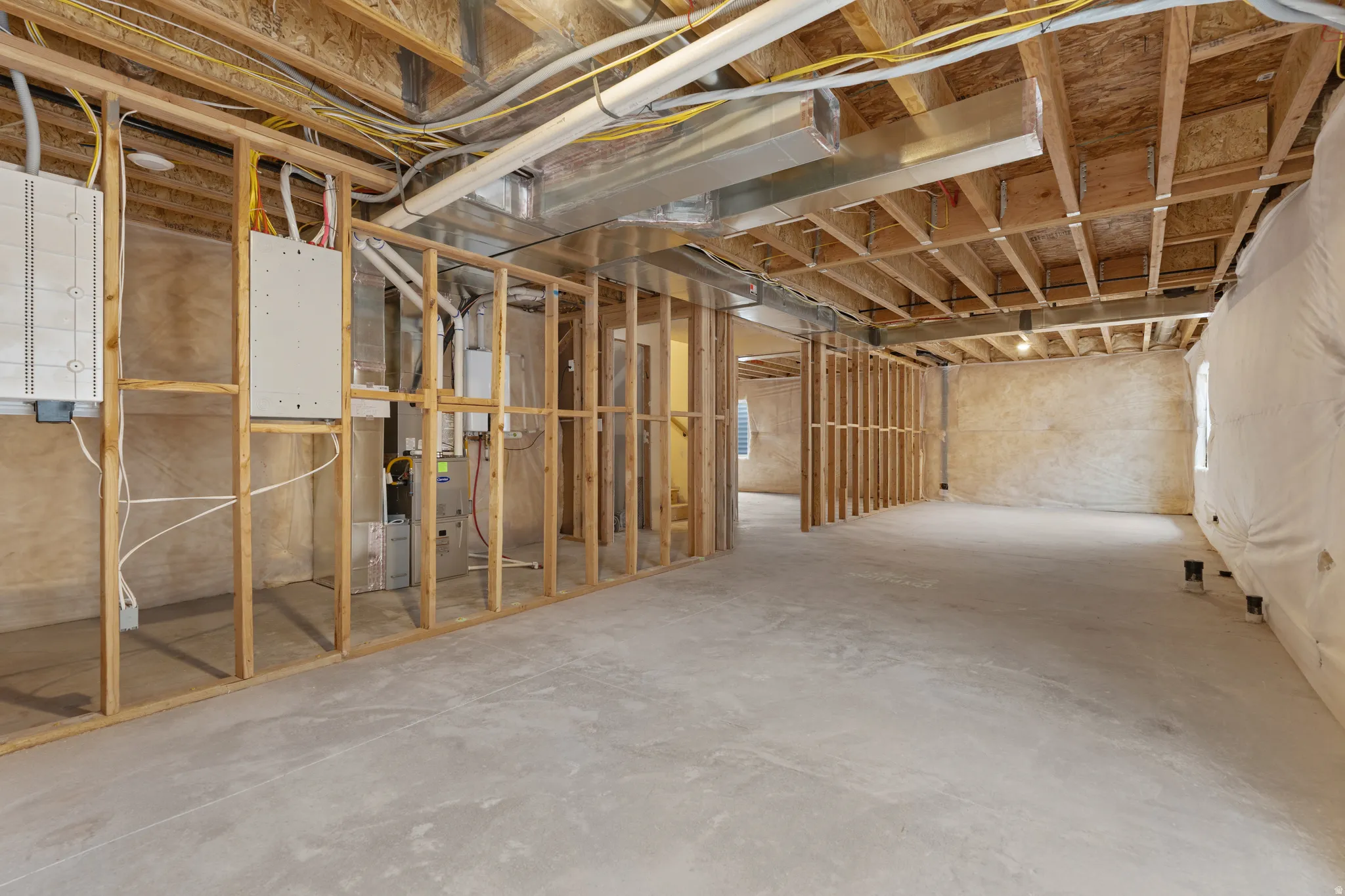 Unfinished basement with heating unit