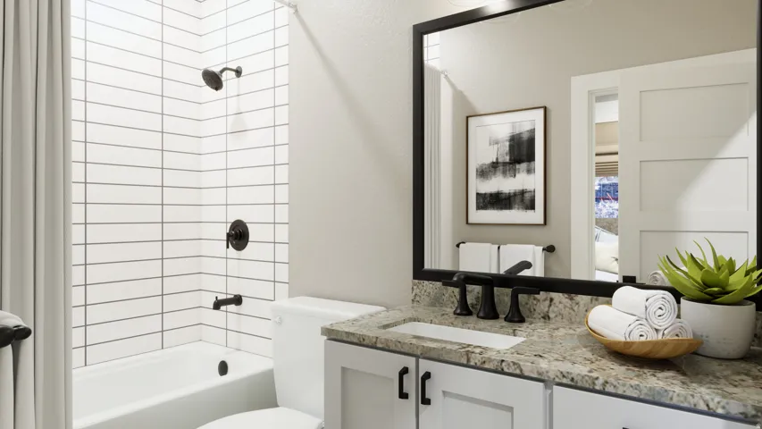 Bathroom with shower / bath combination, vanity, and a textured wall