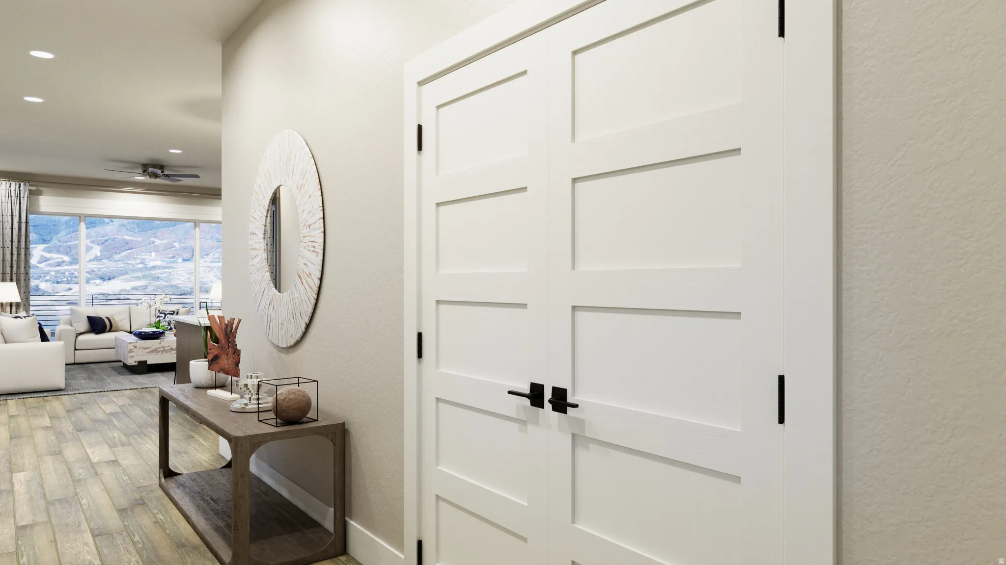 Corridor featuring light wood finished floors, a textured wall, and recessed lighting
