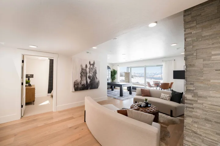 Living area featuring light wood-style floors and recessed lighting