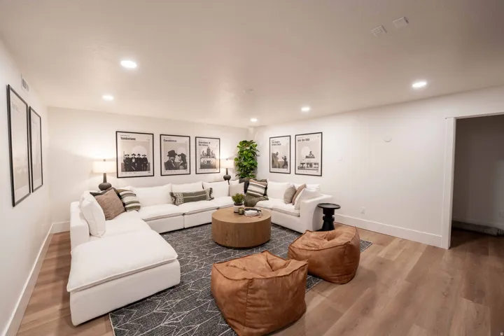 Living area featuring wood finished floors and recessed lighting