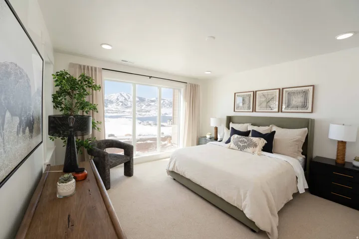 Bedroom with a mountain view and carpet