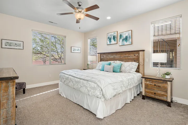 Primary Bedroom with carpet flooring, ceiling fan, and recessed lighting
