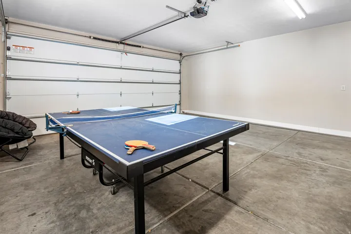 Playroom featuring a garage and concrete floors