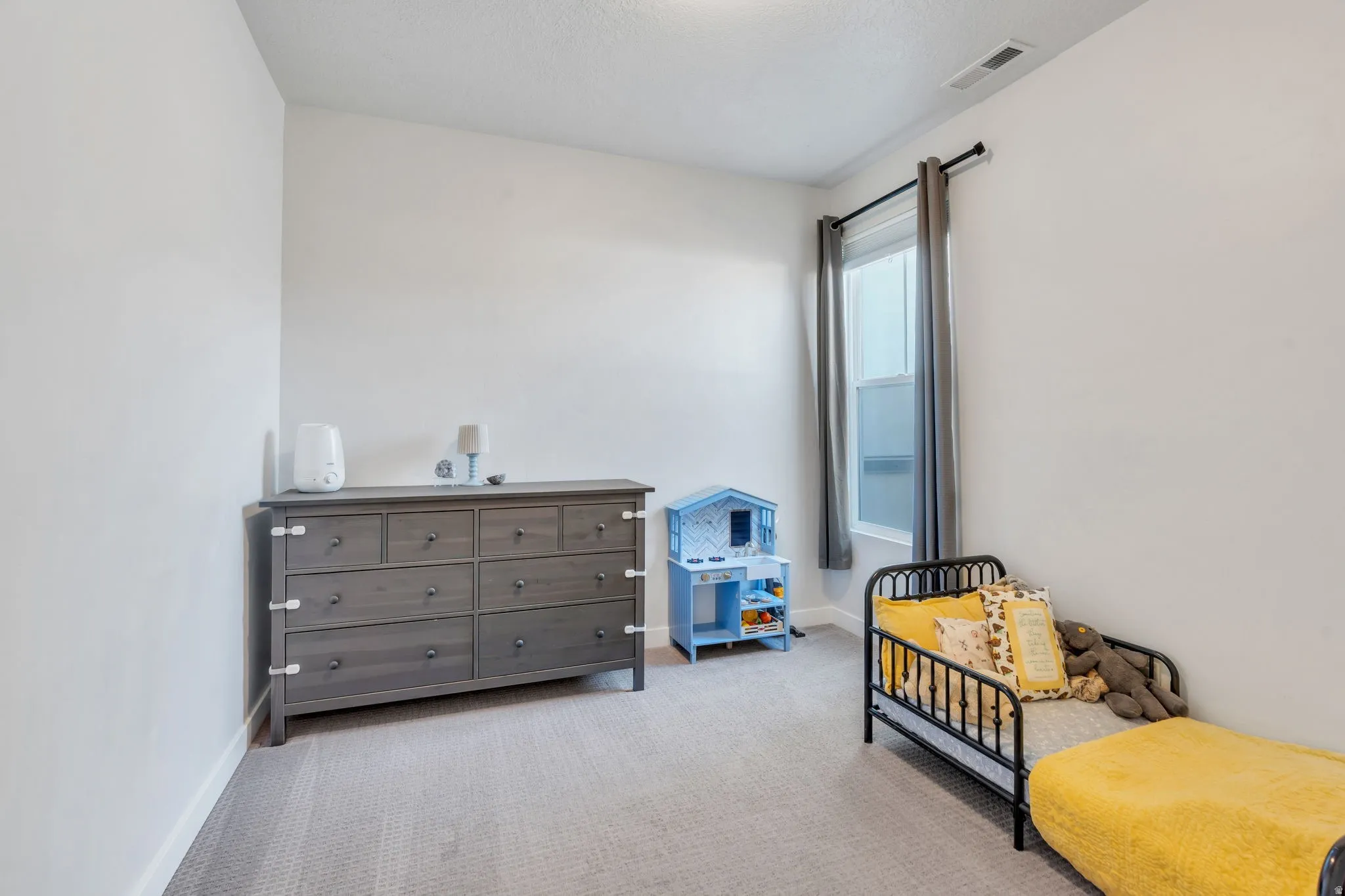 Second bedroom with  ample natural light is perfect for a guest room or home office.