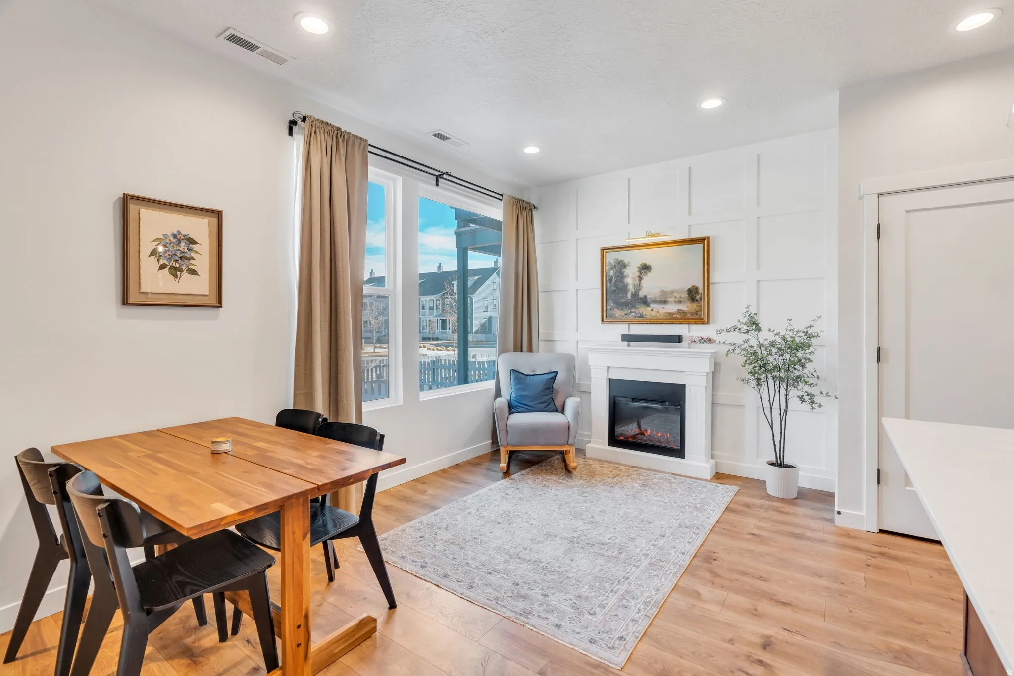 Dining and living room duality featuring a built-in fireplace with great views, room for a couch and dining space