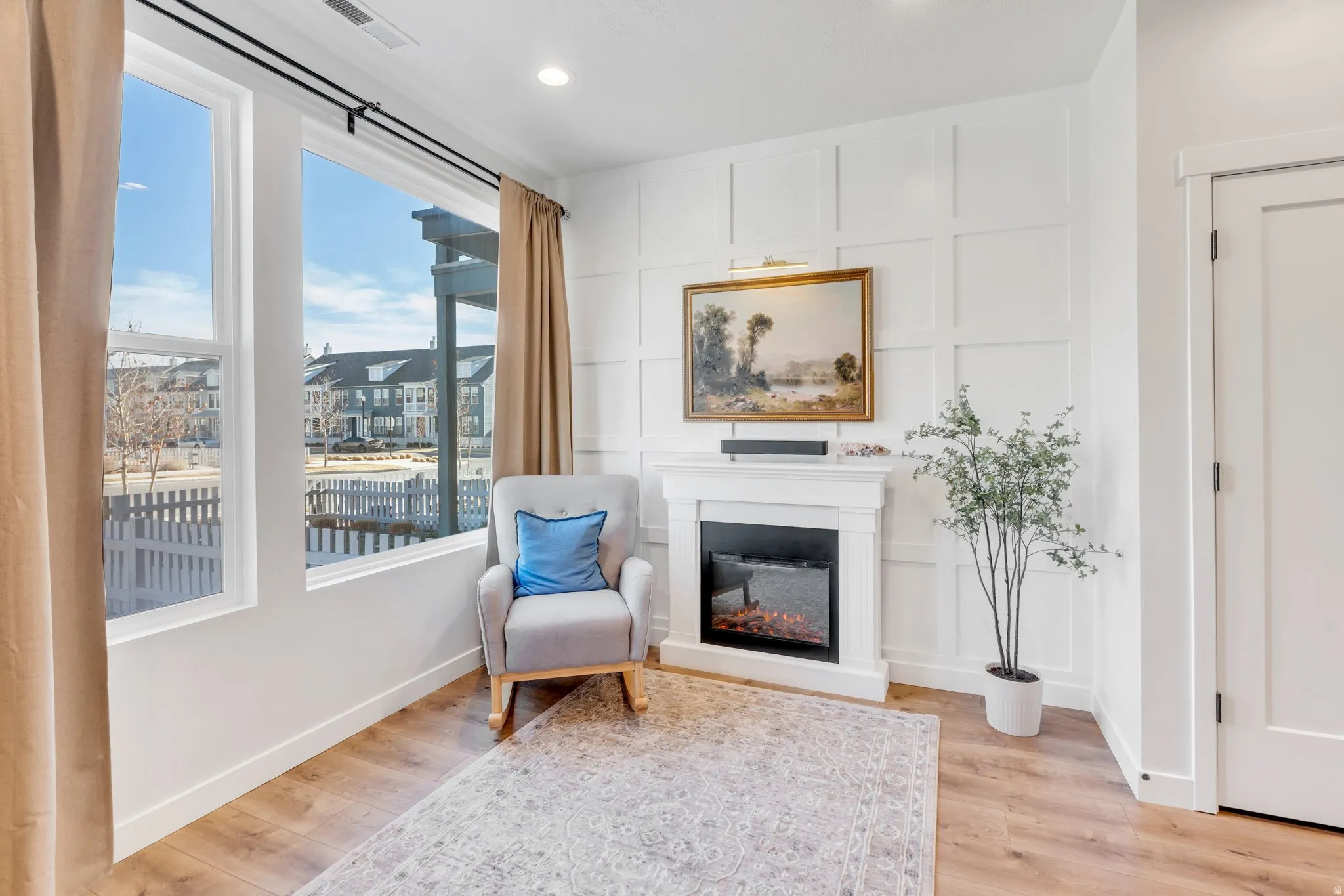 Enjoy this living space including a built-in fireplace with great views!