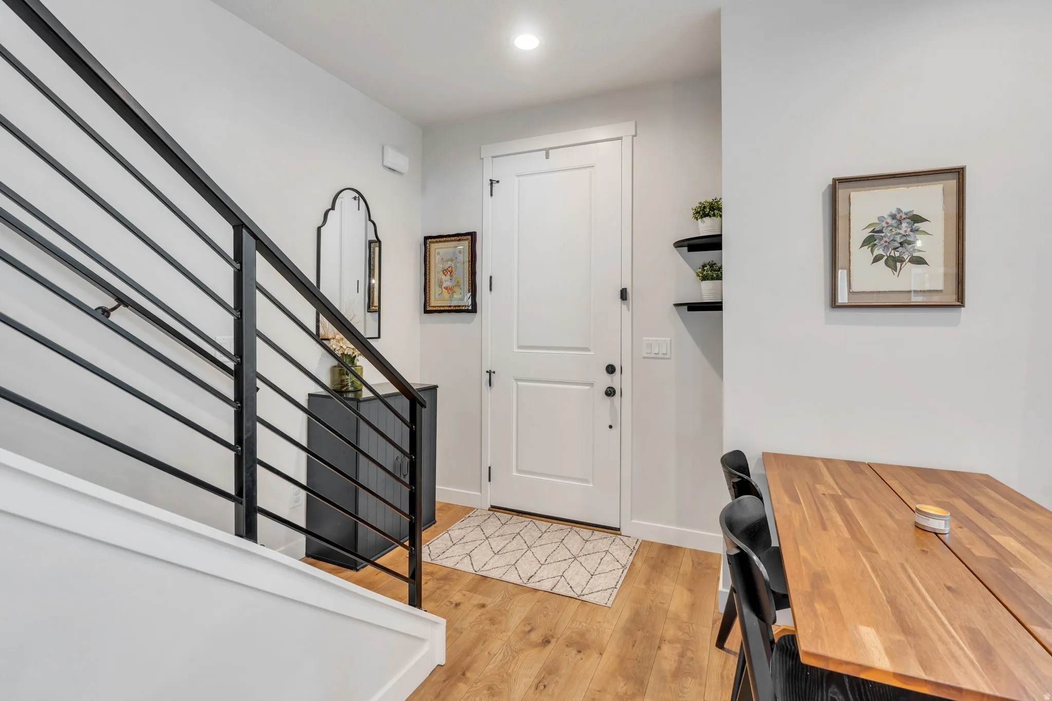 Entry way featuring staircase to the upper-level bedrooms, and rooftop terrace