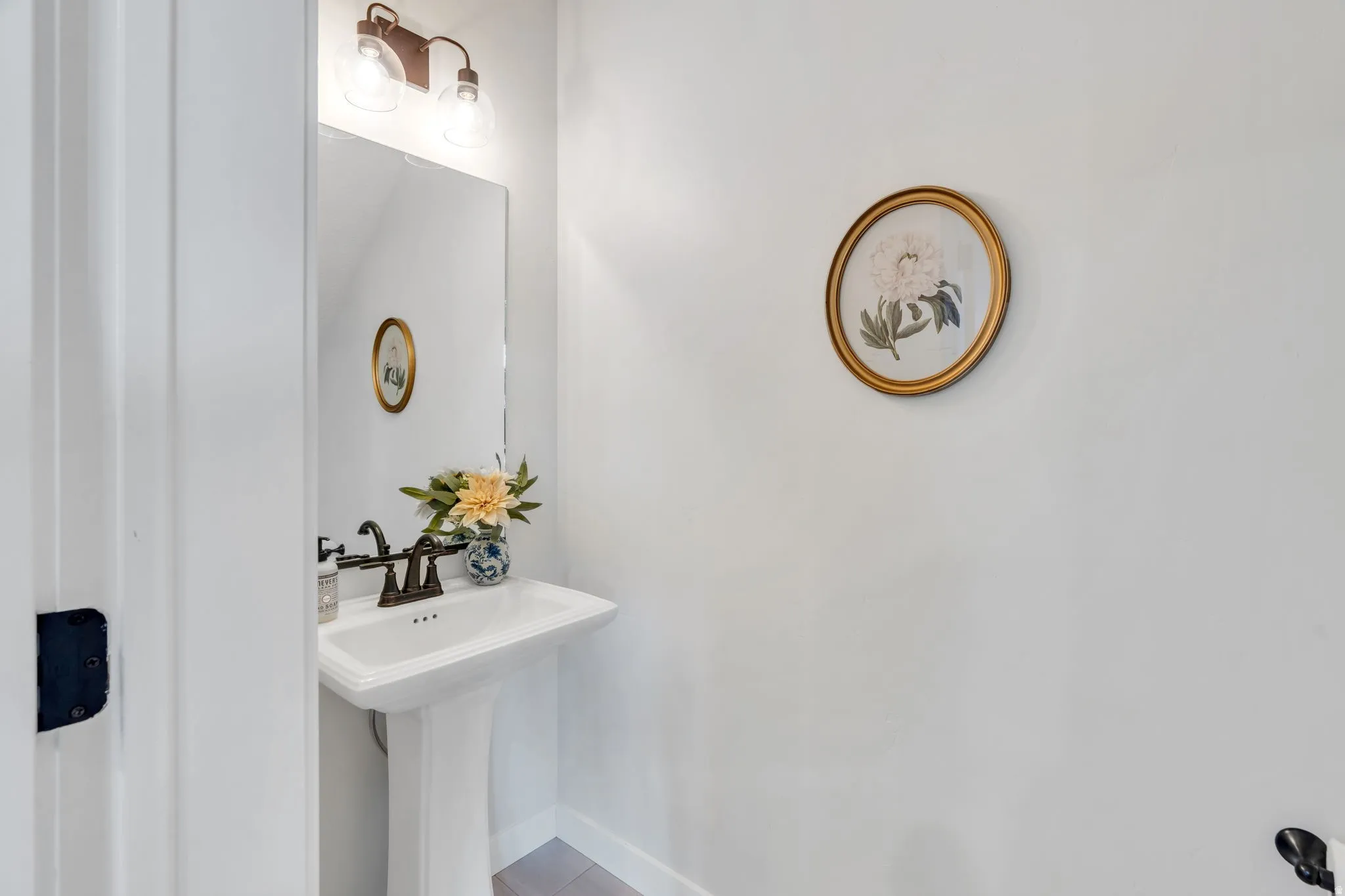 Main level half bath is perfect for guests