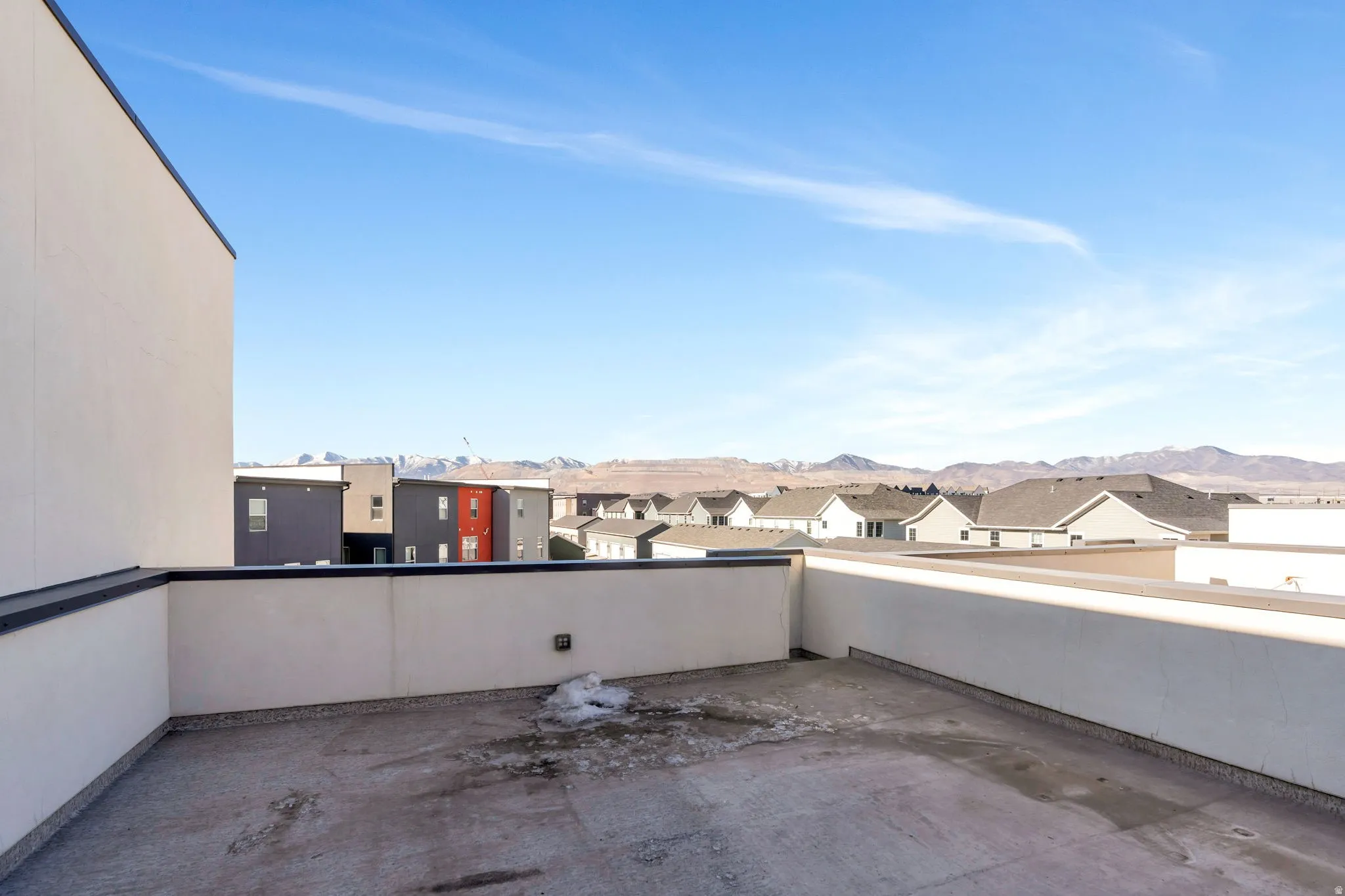 Spacious rooftop terrace featuring staircase to the lower balcony facing West