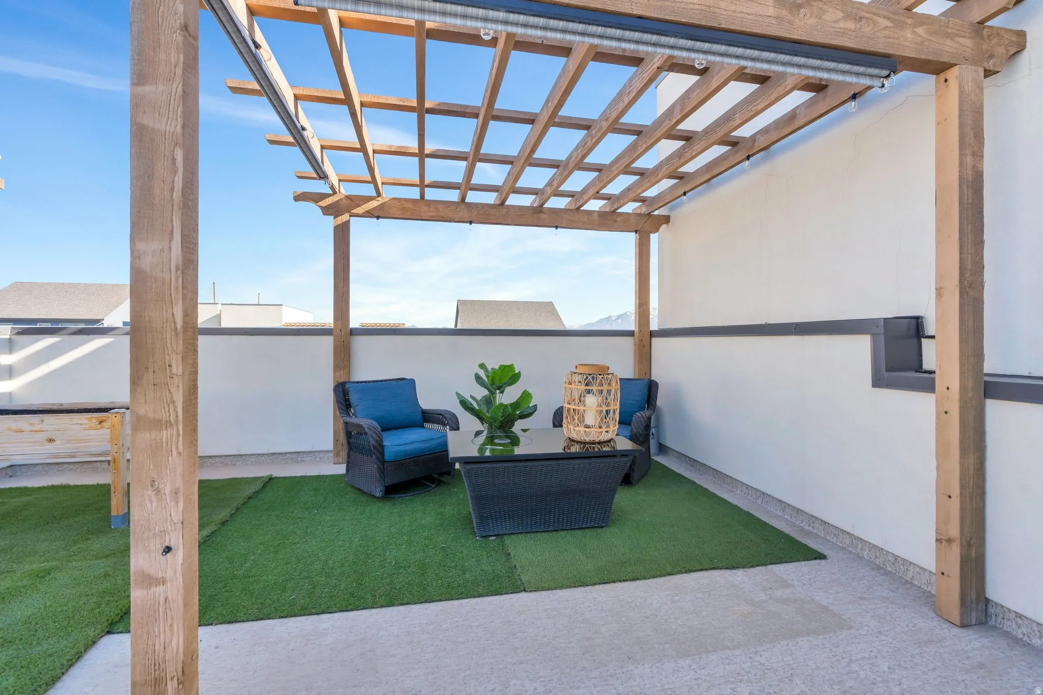 Featuring a built-in pergola perfect for hanging lights, pulling down the shades and relaxing