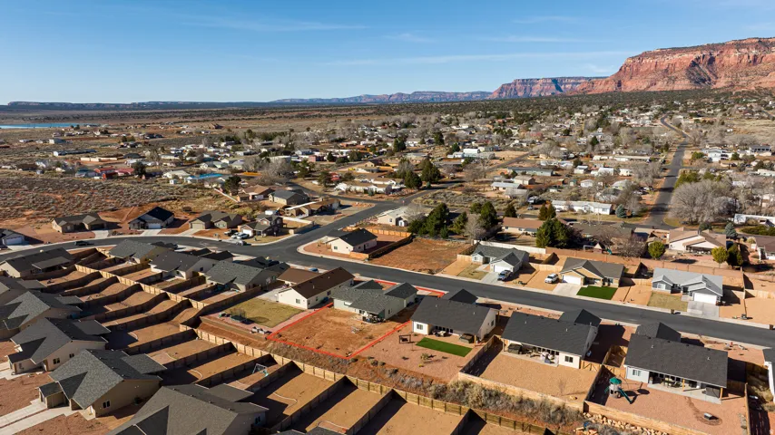 Aerial view of residential area featuring a mountainous background
