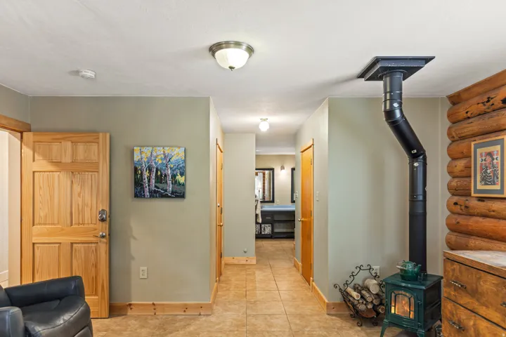 Corridor with baseboards and rustic walls