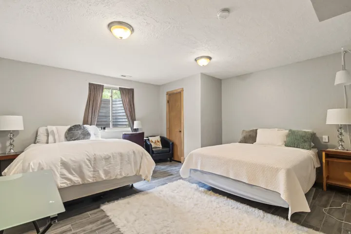 Bedroom featuring wood finish floors and a textured ceiling
