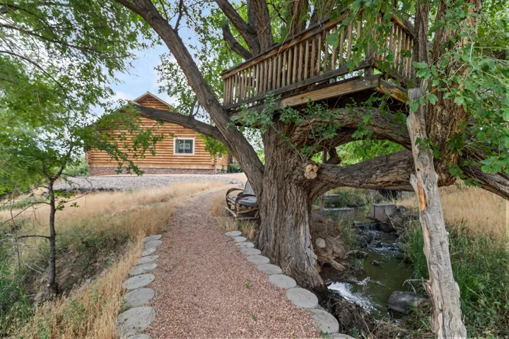 View of yard with a wooden deck