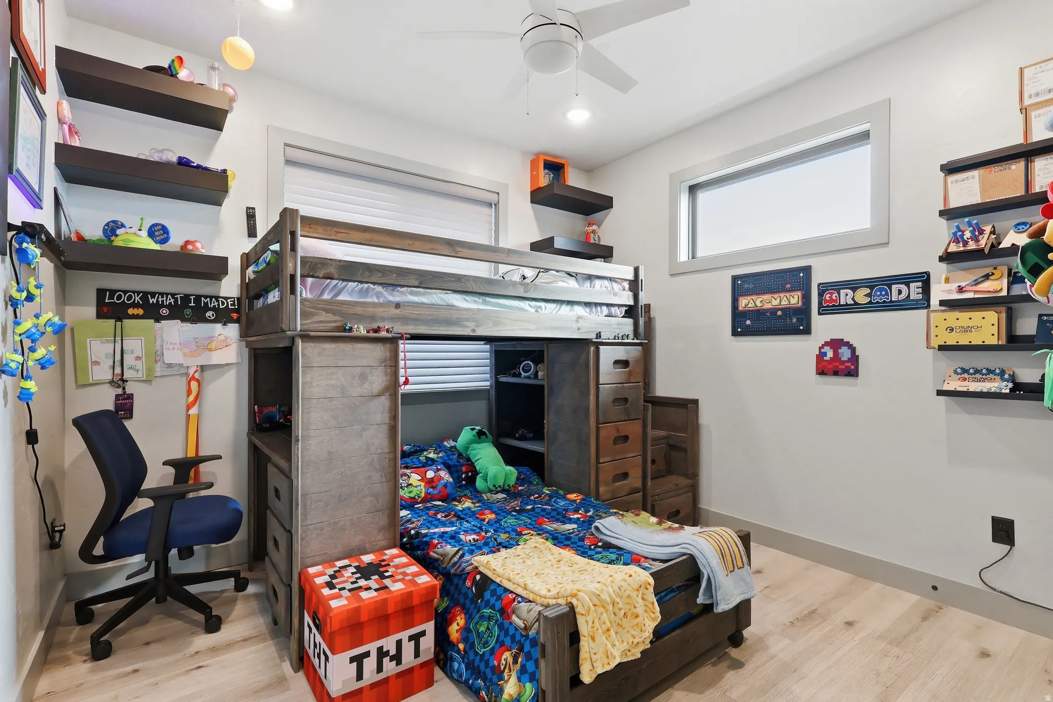 Bedroom featuring light wood-type flooring and a ceiling fan