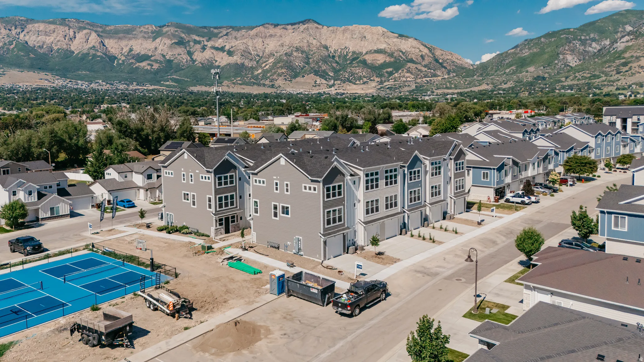Aerial perspective of suburban area featuring a mountainous background