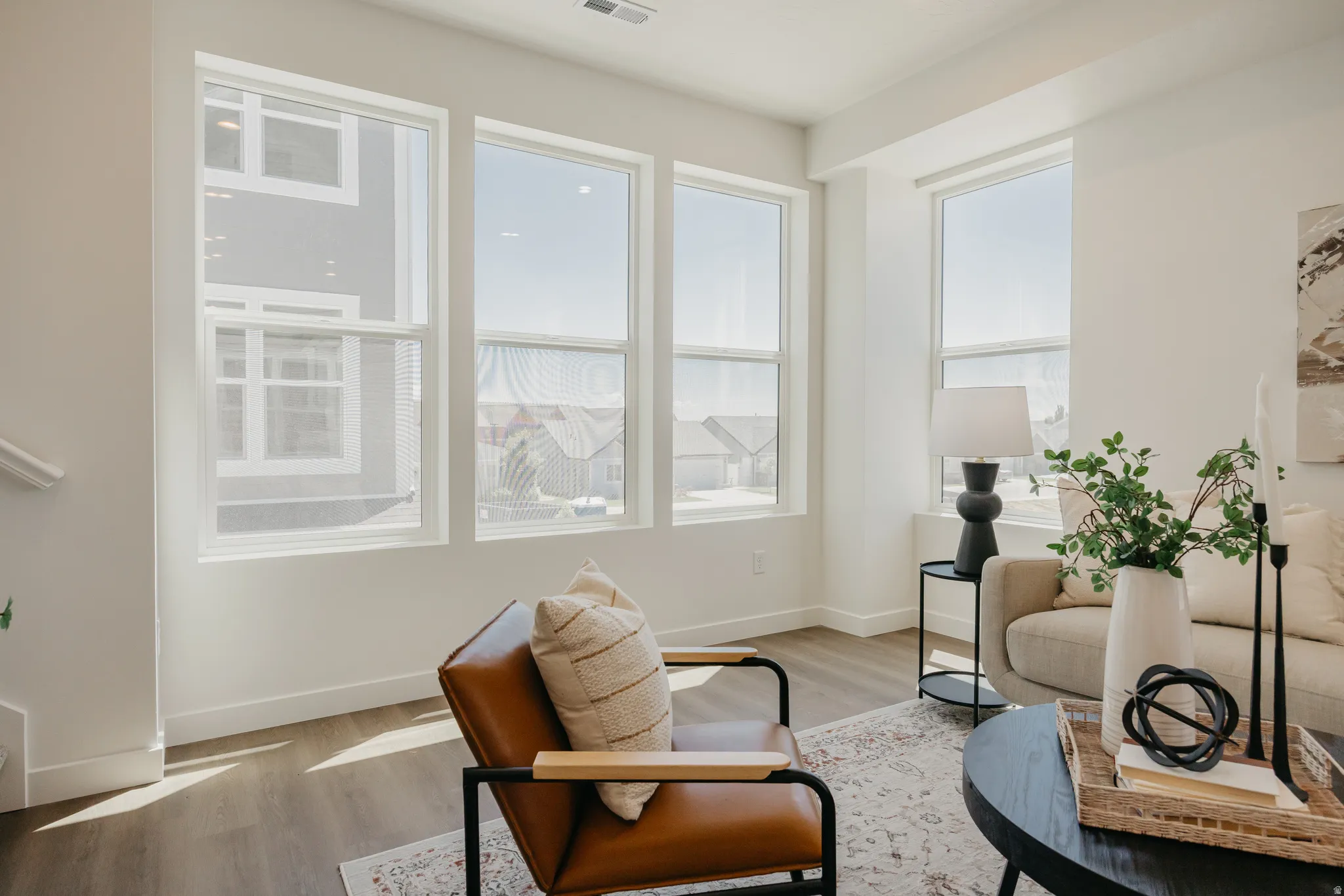 Sitting room with light wood finished floors and baseboards