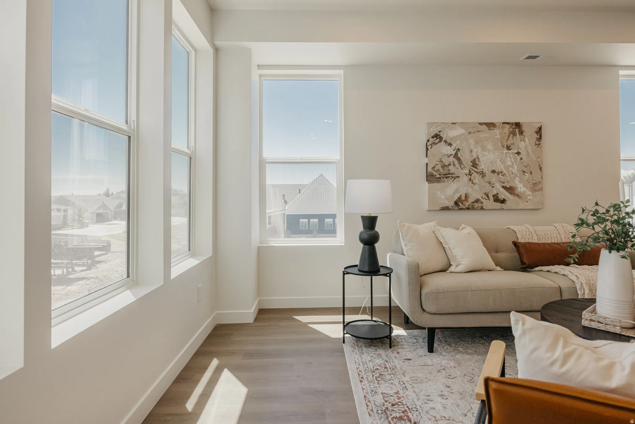 Living room with wood finished floors and plenty of natural light