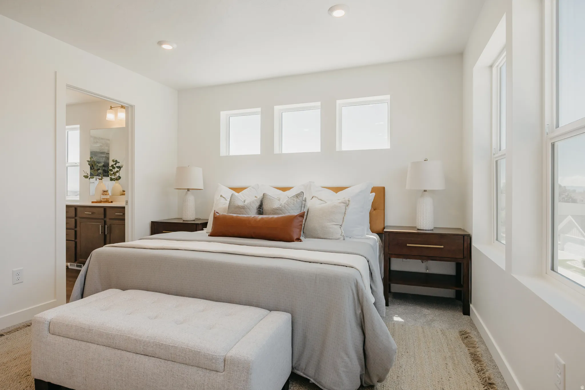 Bedroom featuring recessed lighting and ensuite bath