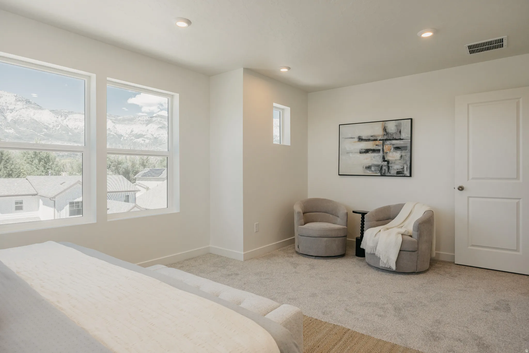 Bedroom featuring carpet flooring, recessed lighting, and a mountain view
