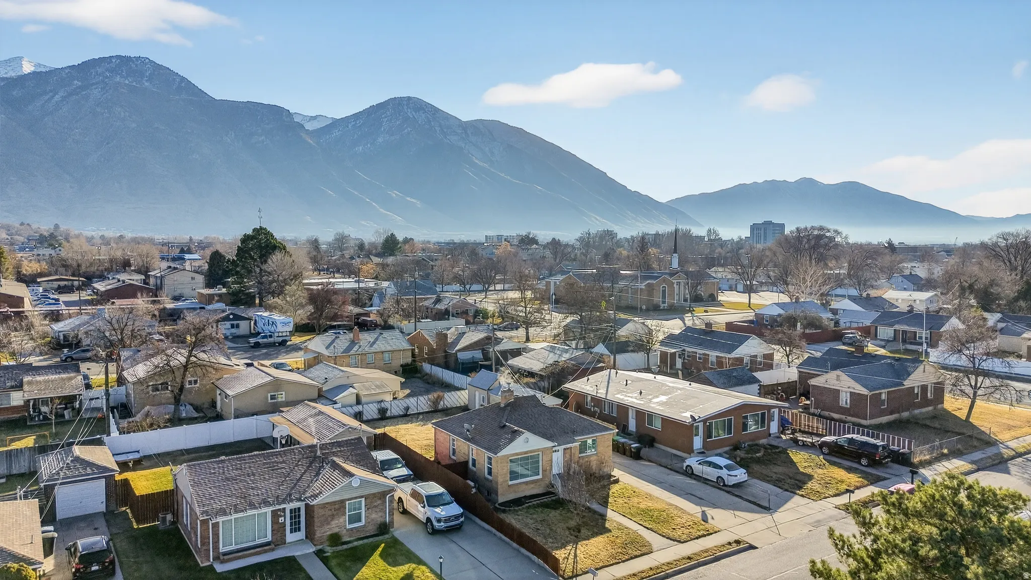 Aerial view of residential area with a mountainous background