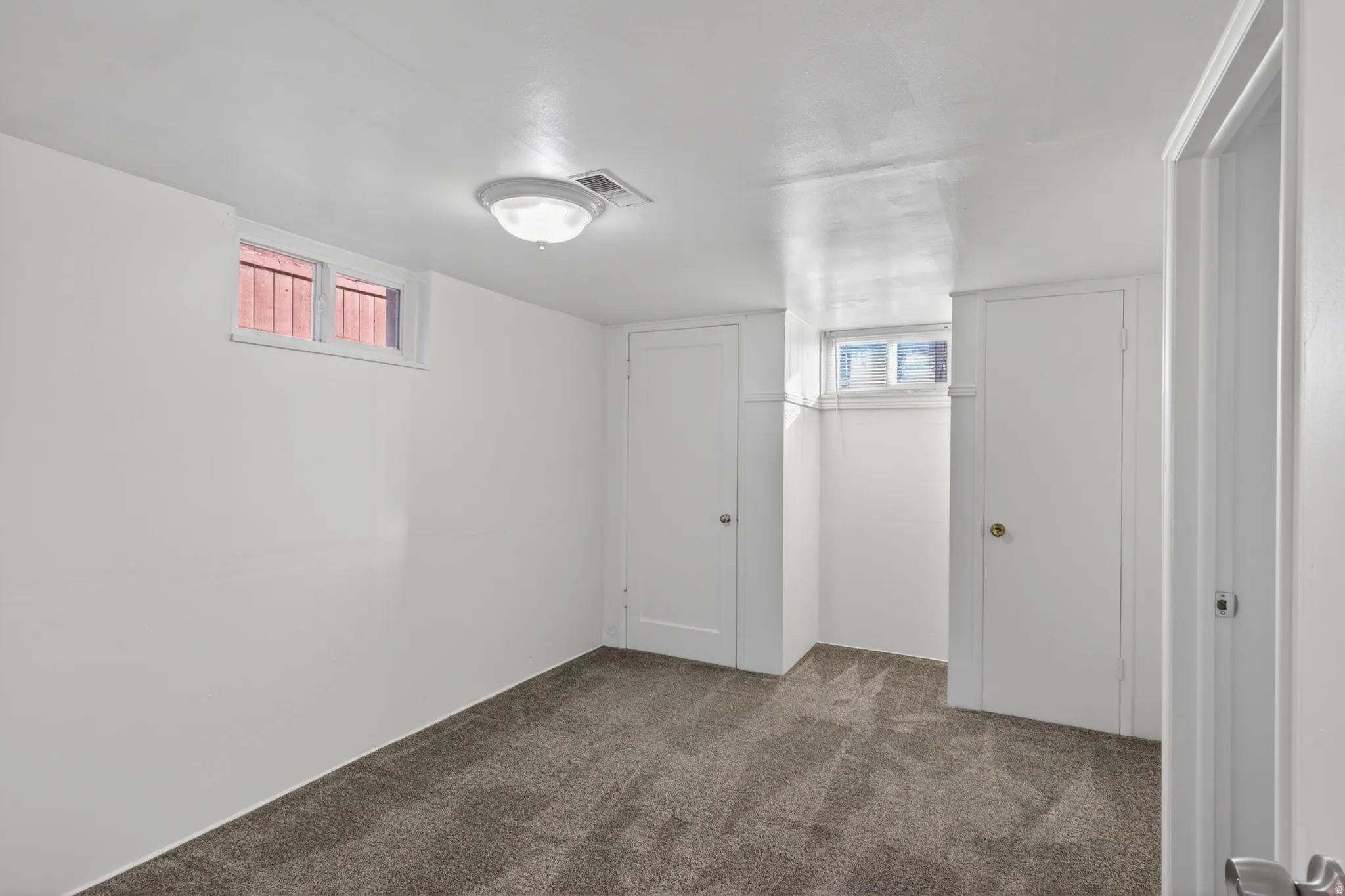 Basement with carpet flooring