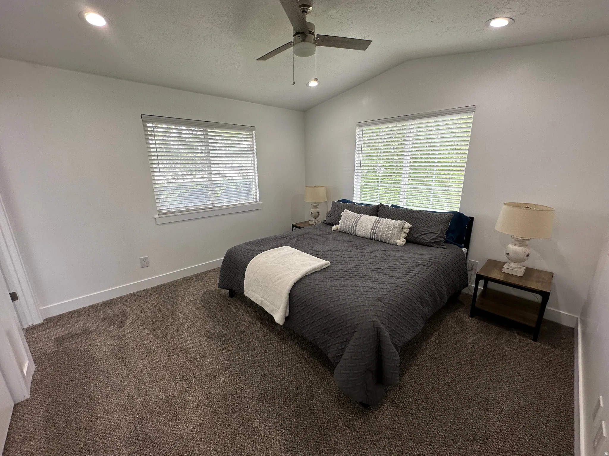Bedroom with recessed lighting, a ceiling fan, and dark carpet