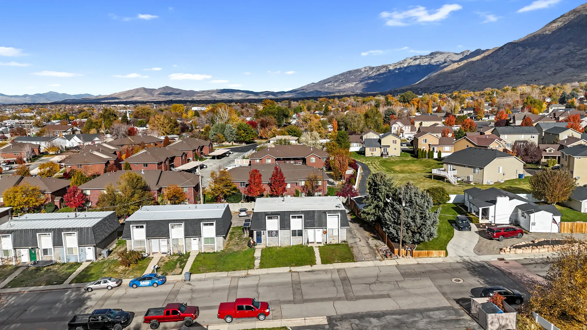 Aerial perspective of suburban area with a mountain backdrop