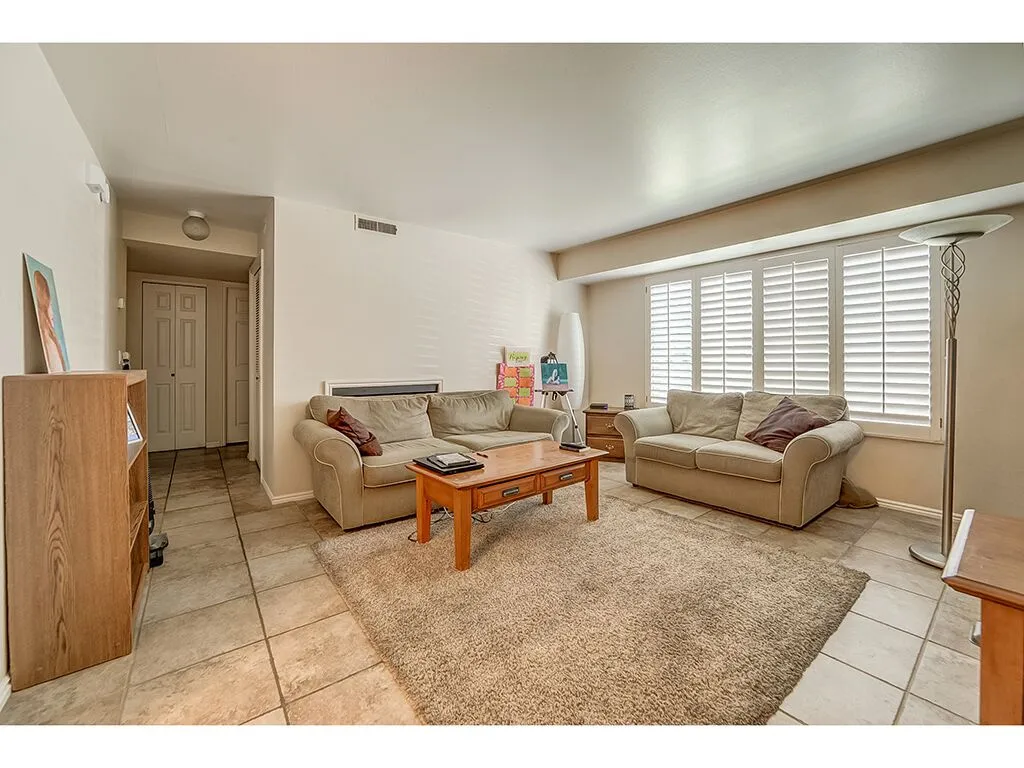 Living room featuring light tile patterned flooring