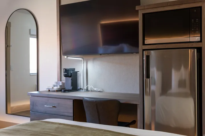 Kitchen featuring appliances with stainless steel finishes and light countertops