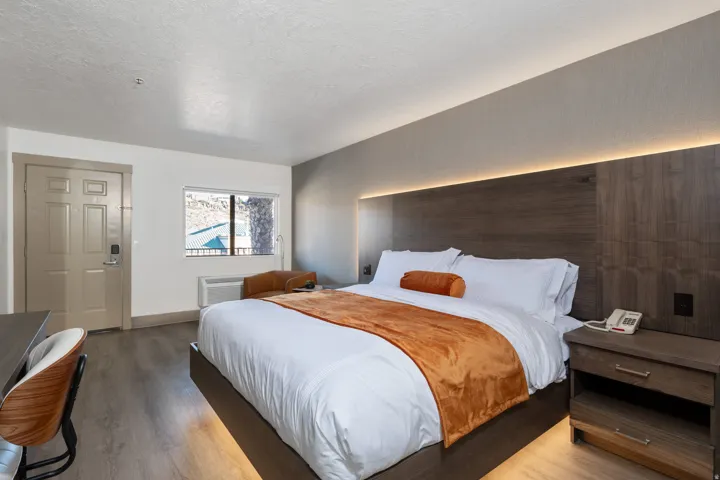 Bedroom featuring wood finished floors and a textured ceiling