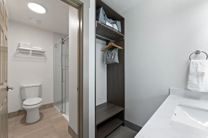 Bathroom featuring vanity and a stall shower