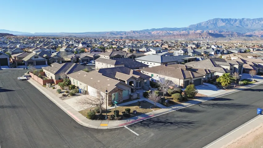 Aerial perspective of suburban area with a mountainous background