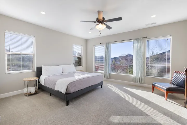 Bedroom featuring ceiling fan, carpet flooring, and recessed lighting