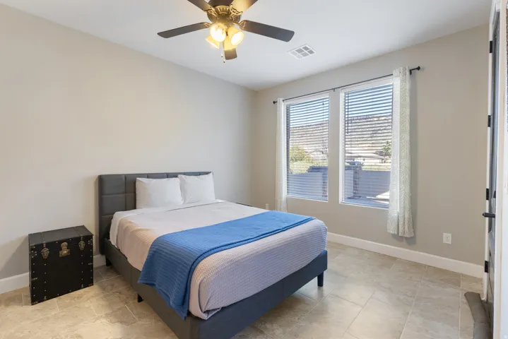 Bedroom featuring baseboards and a ceiling fan