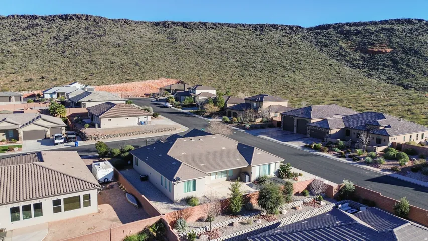 Aerial perspective of suburban area with a mountain backdrop
