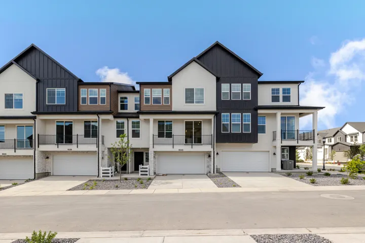 Modern townhome exterior featuring clean lines and a contemporary color palette