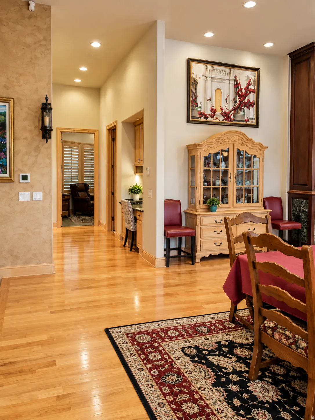 Hardwood flooring throughout, recessed lighting, and built-in desk area
