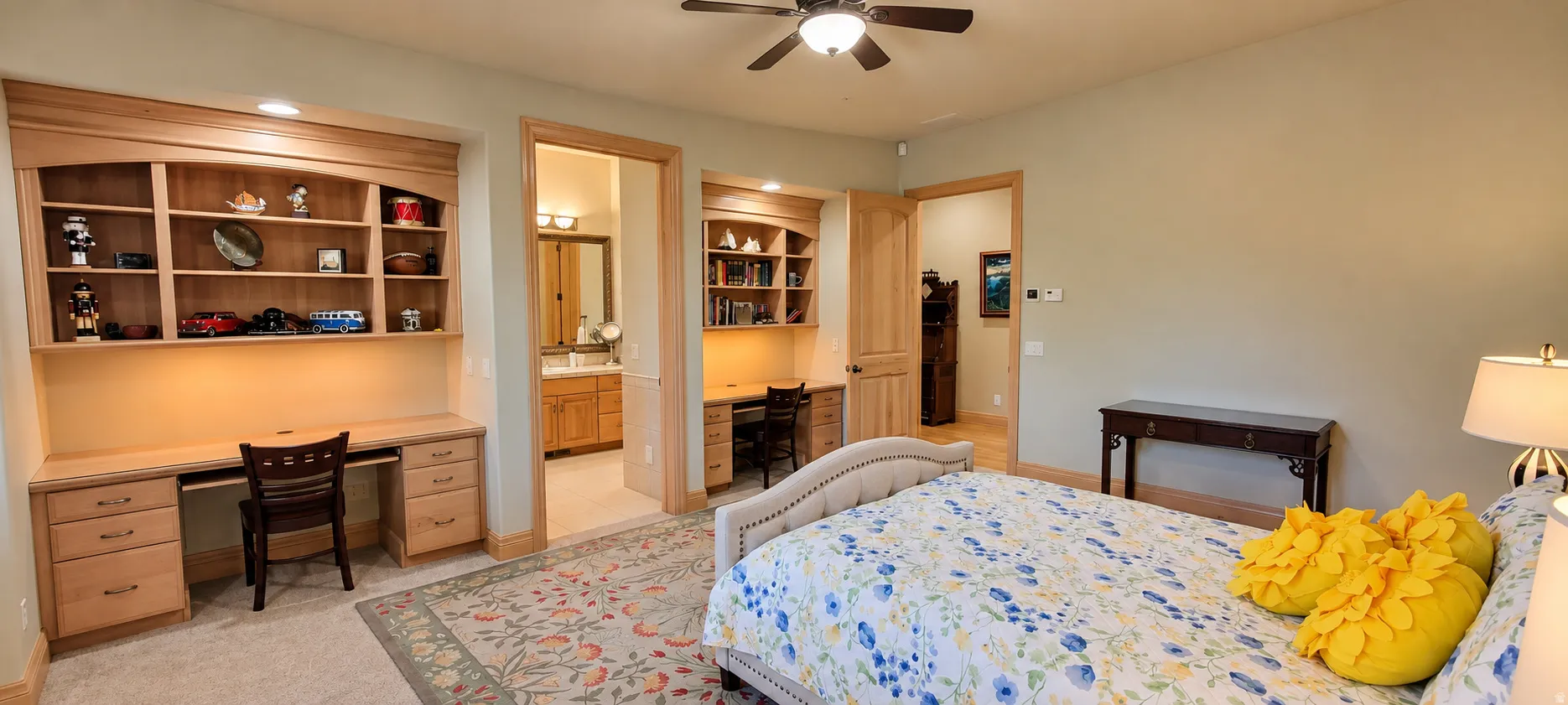 Built-in wood cabinetry with shelving, recessed lighting, and integrated desk