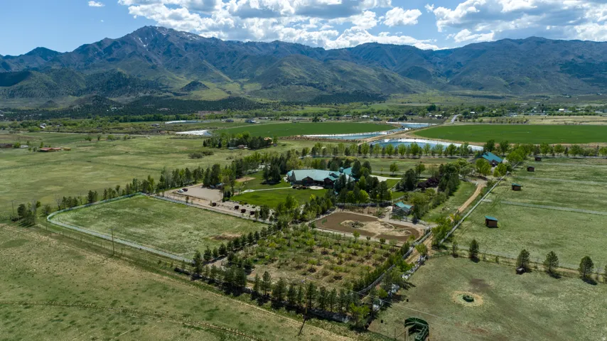View of mountain backdrop with rural landscape and a pastoral area