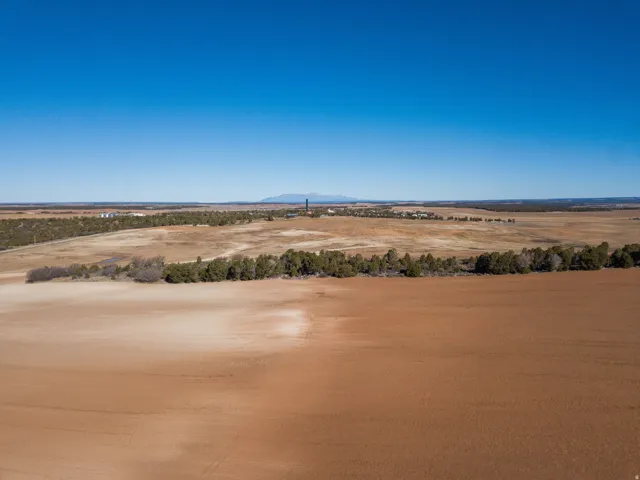 Water view with rural landscape and a mountain backdrop