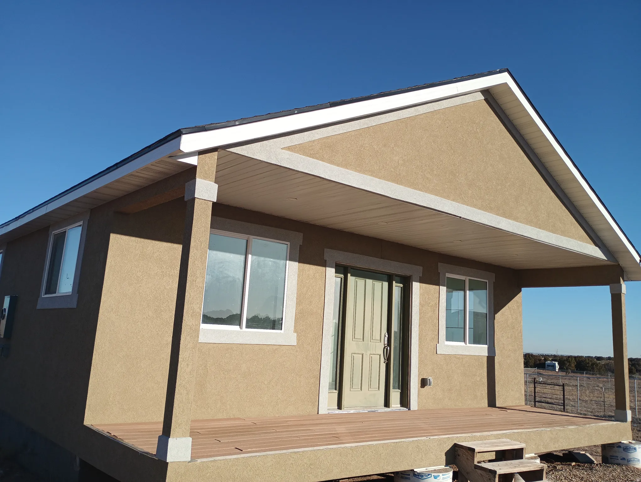 Back of house with stucco siding