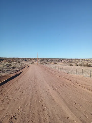 View of dirt / gravel road featuring a view of countryside