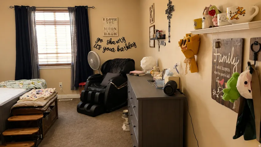 Room featuring neutral wall paint and carpet flooring