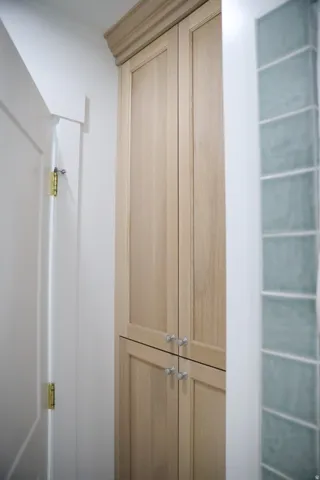 large white oak storage in basement bathroom